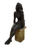 Walter Awlson (Scottish, b.1949), a raku glazed study of a seated female, raised on stone base, 64cm