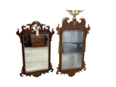 Two George III style parcel gilt mahogany fret cut wall mirrors, largest height 104cm