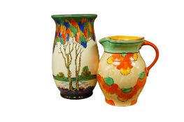 A Crown Ducal Trees pattern vase, height 22cm and a Hancocks Ivory Ware jug (2)