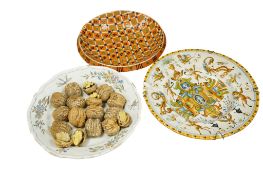 A late 19th century French trompe l'oeil faience dish of walnuts, an Italian Deruta maiolica dish,