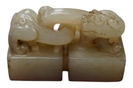 A Chinese jade double seal carved with a dragon, 4.3cm wide