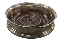 A George III silver wine coaster, no maker's mark, London, 1796, with turned wooden base, diameter