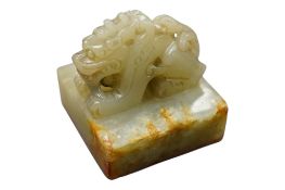 A Chinese jade ‘dragon’ seal, 4cm square