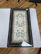 A 19th century Chinese embroidered sleeve band, framed, overall 67 x 34cm