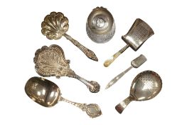 A collection of six assorted silver caddy spoons, including a jockey cap, maker possibly John