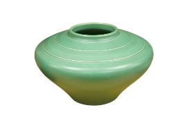 Keith Murray for Wedgwood, a matt green glazed squat circular vase, height 16cm.