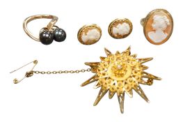 A yellow metal star brooch, 41mm, together with a yellow metal and cameo shell set ring, a pair of