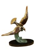An Art Deco patinated spelter bird on slate base, 52cm high