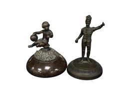 Two 19th century spelter figures: a seated putti on a domed granite base and a standing theatrical
