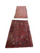 A Tekke Bokhara red ground rug and a Persian polychrome runner, largest 255 x 97cm