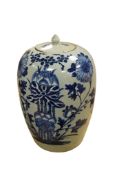 A Chinese celadon ground jar and cover, painted in underglaze blue, 33cm high