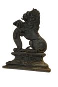 A Victorian cast iron doorstop in the form of a rampant lion, 37cm high