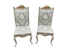 A pair of 19th century Italian rococo revival cream and gilt hall chairs, width 51cm, depth 60cm,