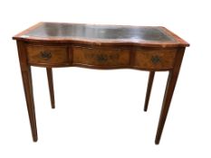 A reproduction walnut writing table, width 94cm, depth 49cm, height 78cm