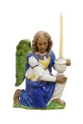 An Italian majolica pottery study of a kneeling angel in Della Robbia-style, 49cm high