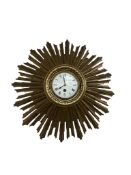 An early 20th century giltwood sunburst wall timepiece, 46cm in diameter