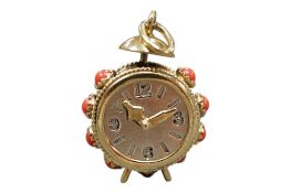 A late 20th century 9ct gold and coral bead set novelty charm, modelled as an alarm clock, overall