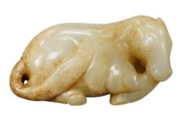A Chinese pale celedon and a russet jade carving of a horse, 8cm wide