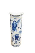 A late 19th/early 20th century Chinese blue and white sleeve vase decorated with street performers