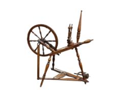 An early 19th century spinning wheel, width 78cm, depth 40cm, height 81cm