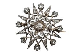 A Victorian yellow and white metal, diamond cluster star pendant brooch, set with old mine cut