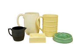 Keith Murray for Wedgwood, two ribbed mugs, two ashtrays and a cream jug. Largest 13cm high (5)