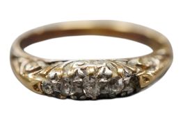 An early 20th century 18ct and four(ex 5) stone diamond chip set ring, size O, gross weight 3.2
