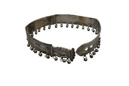 A Sudanese white metal belt, surmounted with bells, approx. length 60+cm.