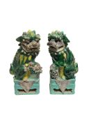 A pair of Chinese porcelain glazed Foo dogs, 23cm high
