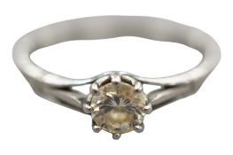 A white metal (stamped plat) and solitaire diamond ring, size O, gross weight 2.3 grams.