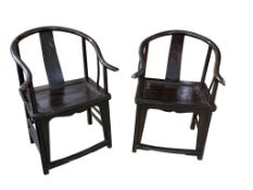 A pair of Chinese stained elm horseshoe back armchairs, Quanyi, Qing dynasty, with solid seats,