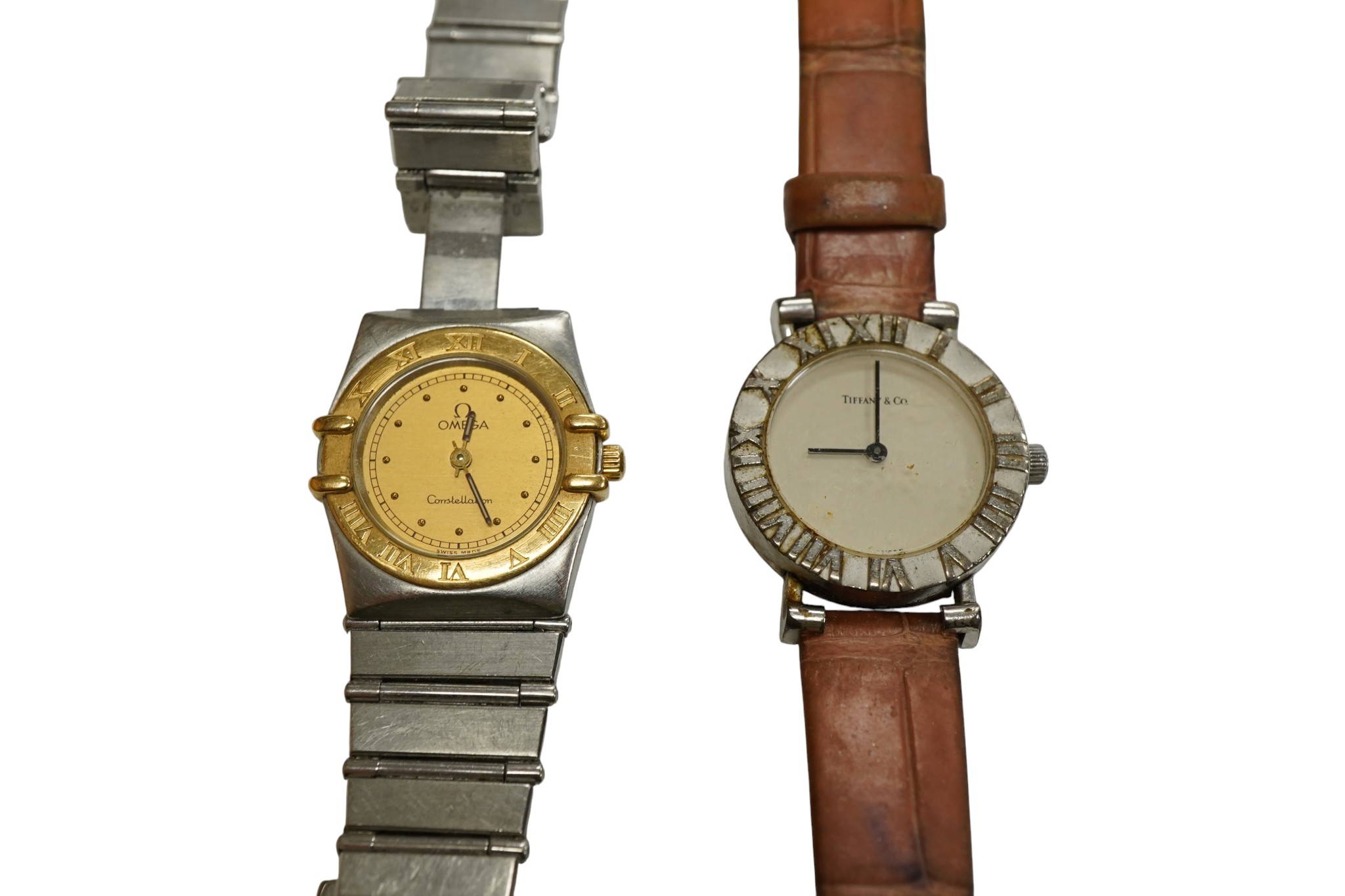A lady's steel and gold plated Omega Constellation quartz wrist watch, on a steel Omega bracelet(a.f