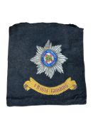An embroidered military cushion cover for the Irish Guards, 41 x 39cm