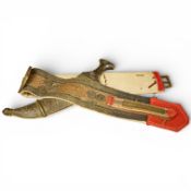 A 20th century Yemeni dagger Jambiya with white metal mounts, pierced and chased with scrolls