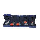 Five Swarovski crystal glass animal figurines to include a penguin, lion and bird of prey, each with