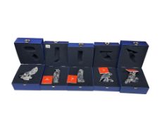 Five Swarovski crystal glass animal figurines to include a penguin, lion and bird of prey, each with