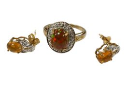 A recent 9ct gold and single stone opal and diamond cluster set oval ring, size N and a pair of