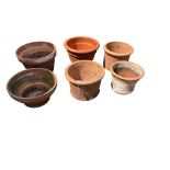 Six terracotta pots, largest diameter 38cm, height 24cm
