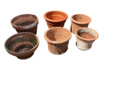 Six terracotta pots, largest diameter 38cm, height 24cm
