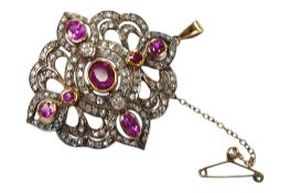 An Indian? yellow metal, ruby and diamond cluster set pendant brooch, of quatrefoil shape, overall