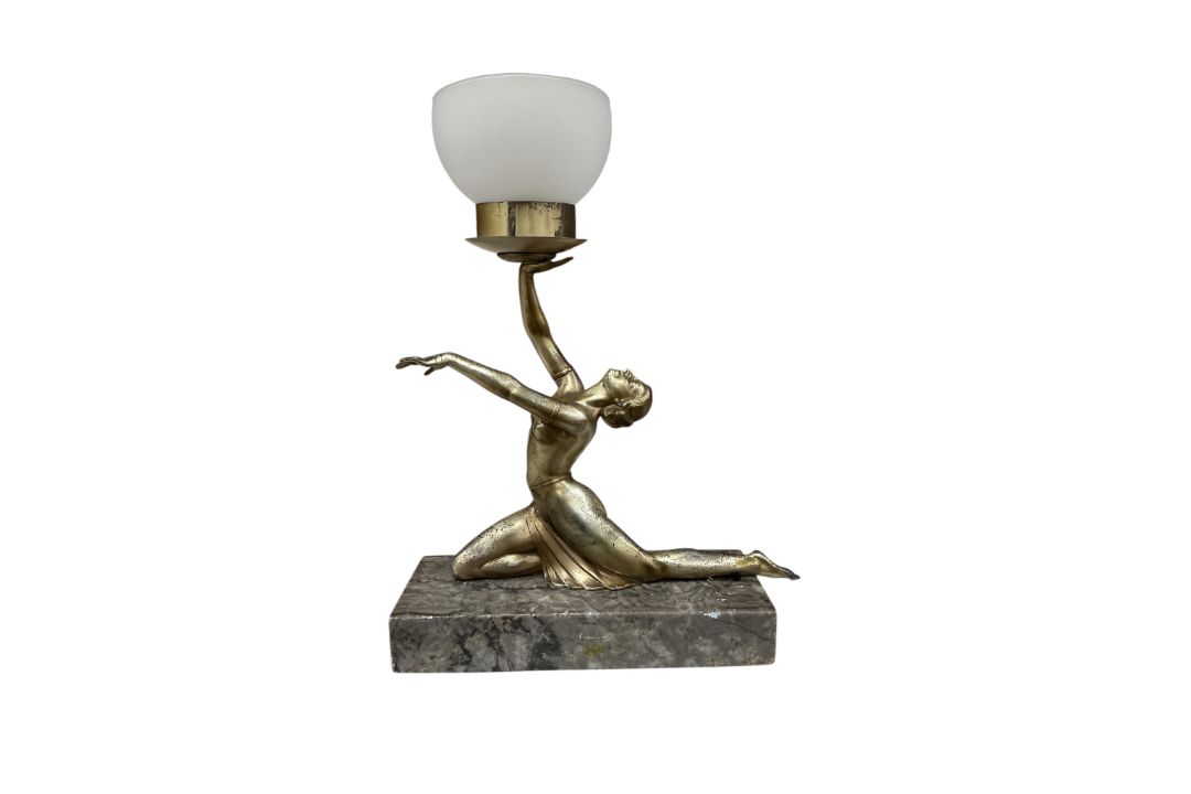 An Art Deco lamp, surmounted with a semi nude woman, with opaque glass shade, 30cm wide - Image 1 of 2
