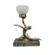 An Art Deco lamp, surmounted with a semi nude woman, with opaque glass shade, 30cm wide - Image 1 of 2