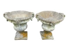 A pair of circular reconstituted stone campana garden urns, diameter 61cm, height 68cm