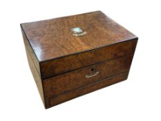 A Victorian burr walnut fitted vanity box, with mother-of-pearl inlay, containing silver-topped