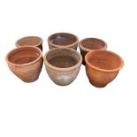 Six terracotta pots, largest diameter 46cm, height 37cm