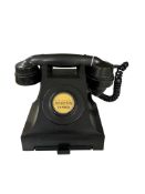 A vintage black Bakelite telephone, with original dial label 