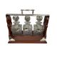 A mahogany and silver-plated tantalus, with three cut glass square decanters and stoppers, - Image 1 of 3