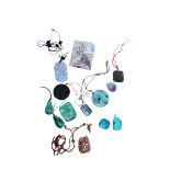A group of Chinese carved jadeite and hardstone pendants to include a turquoise example and an