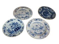 Three mid 18th century English delftware blue and white plates, the largest each painted with a deer