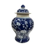 A Chinese blue and white prunus jar and cover, bears six character mark, approx 35cm high.